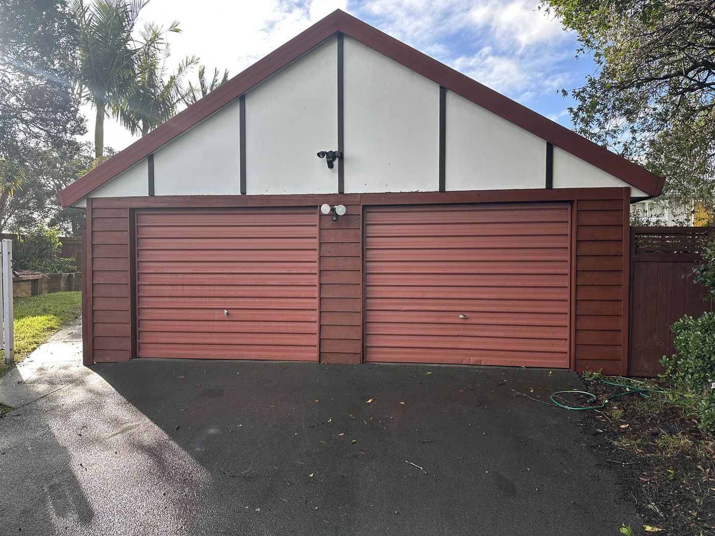 Double timber-look garage doors on an Auckland home